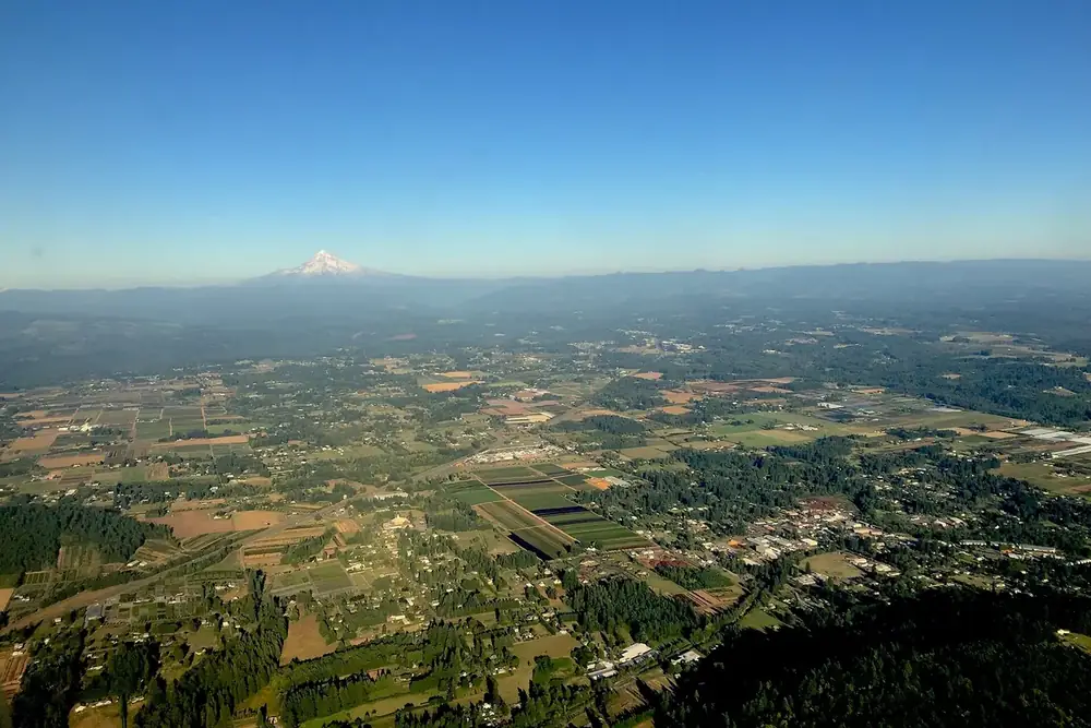 Aerial view of farmland and neighborhoods around Damascus and Boring, Oregon, toward Mount Hood