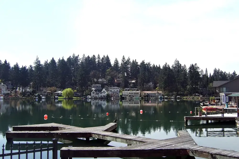 Wooden docks and lakeside homes along Lakewood Bay on Oswego Lake in Lake Oswego, Oregon