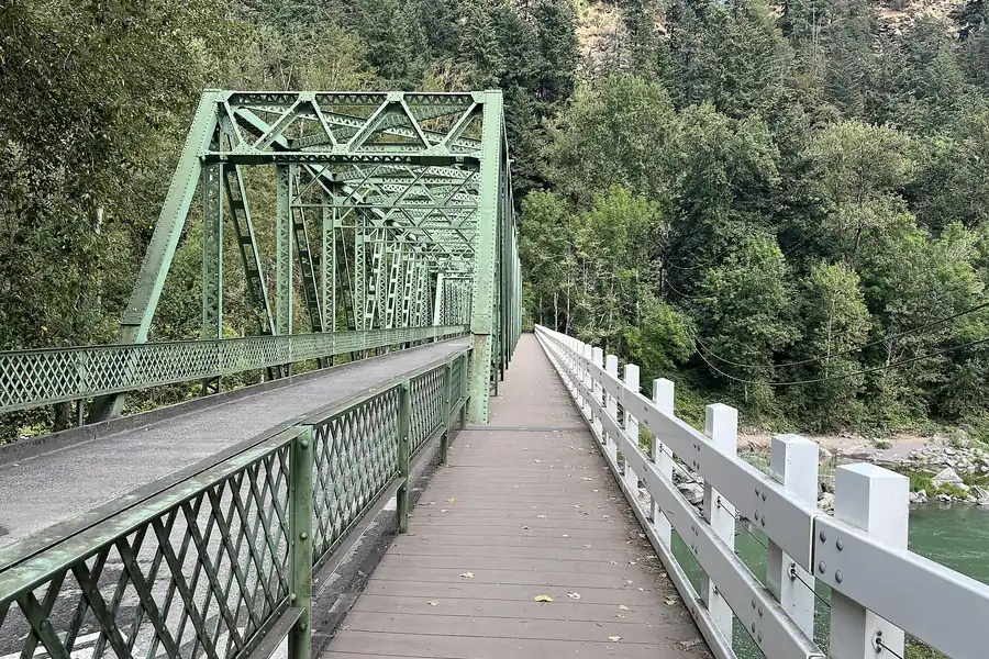 Green steel truss bridge and walkway crossing the Sandy River at Troutdale, Oregon